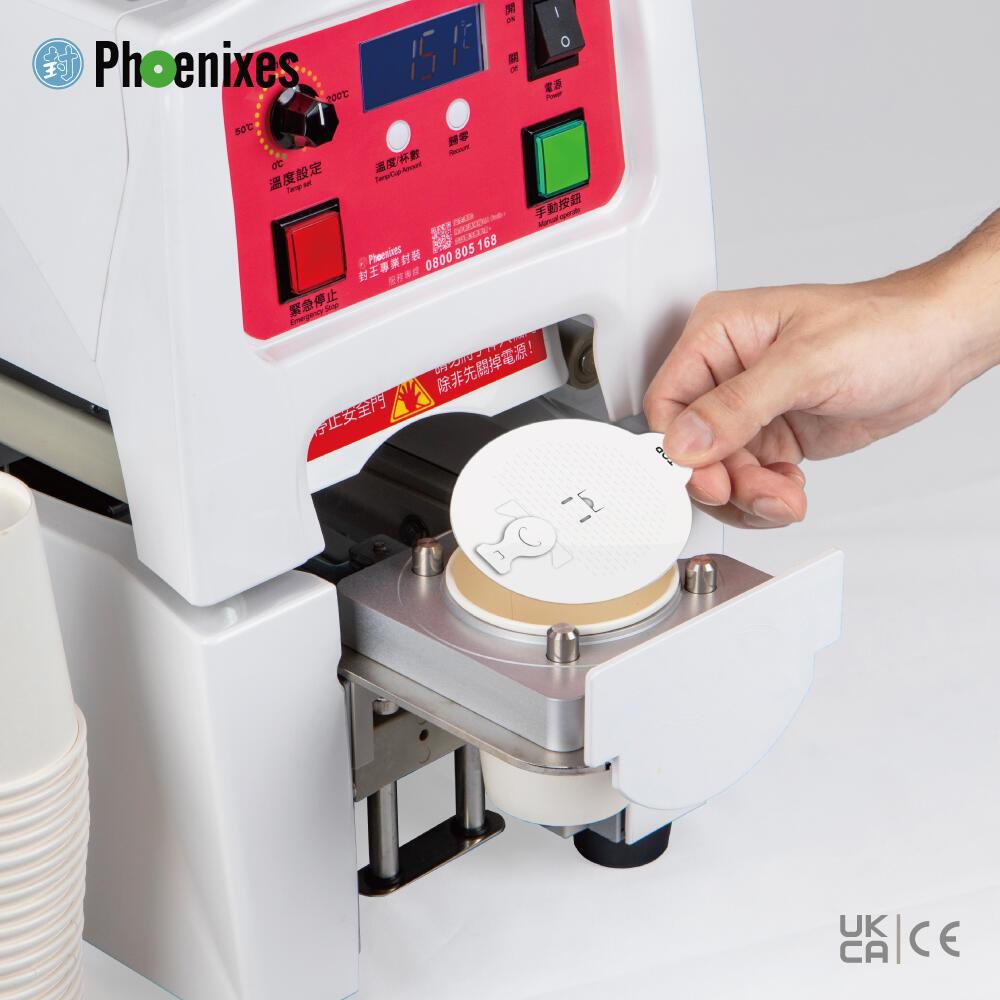 Operator placing a round precut lid on a 90 mm paper cup in the Phoenixes PH-989H
